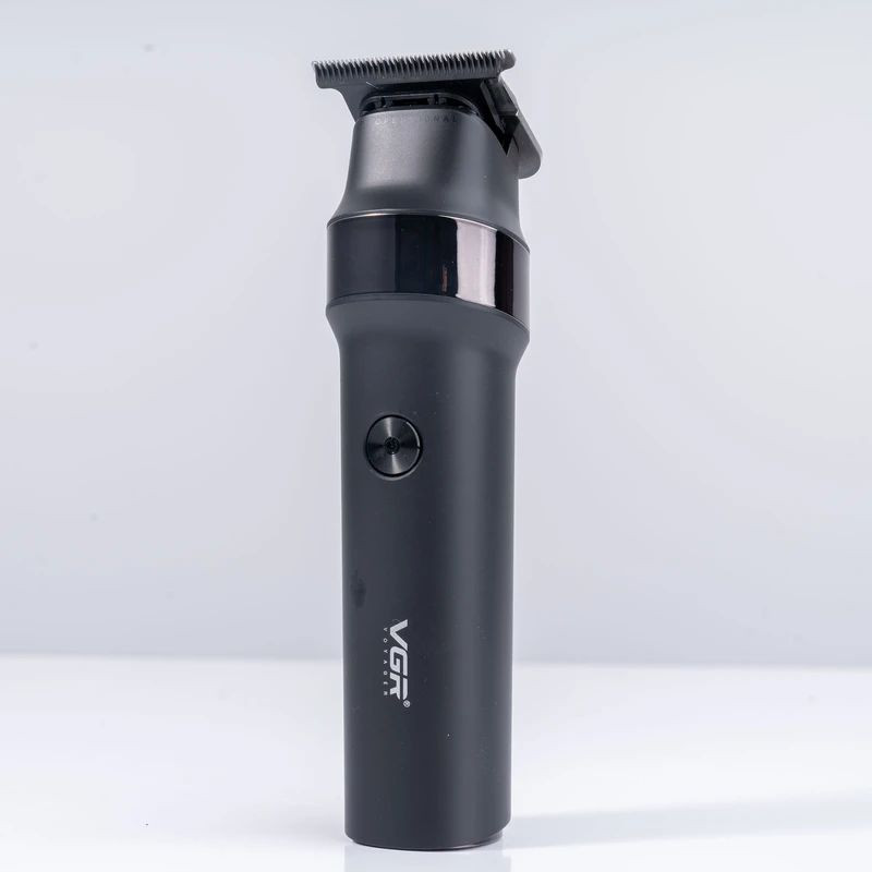 ماشین اصلاح موی سر و صورت وی جی آر مدل V-987 با تیغه سرامیکی و استیل ضد زنگ، موتور دی سی 7000 دور در دقیقه، عملکرد توربو، باتری 2000 میلیآمپرساعتی با 400 دقیقه استفاده و صفحه نمایش الایدی میزان شارژ