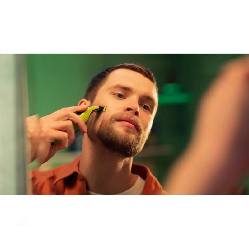 ماشین اصلاح موی صورت فیلیپس مدل QP2724/10 با قابلیت استفاده خشک و مرطوب، ضدآب، تیغه استیل ضدزنگ کربن ضدحساسیت، سیستم محافظت دوگانه، سه شانه 1، 3 و 5 میلیمتری، شارژ 8 ساعت و عمر تیغه 4 ماه